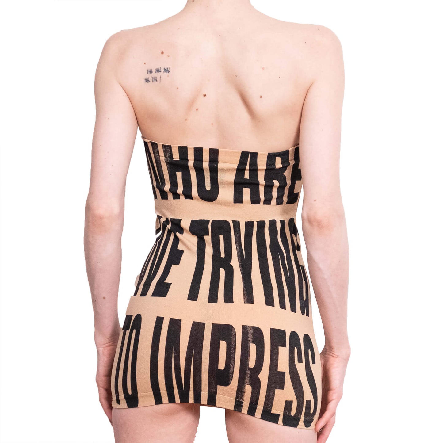 Beige strapless dress with black text on a white background