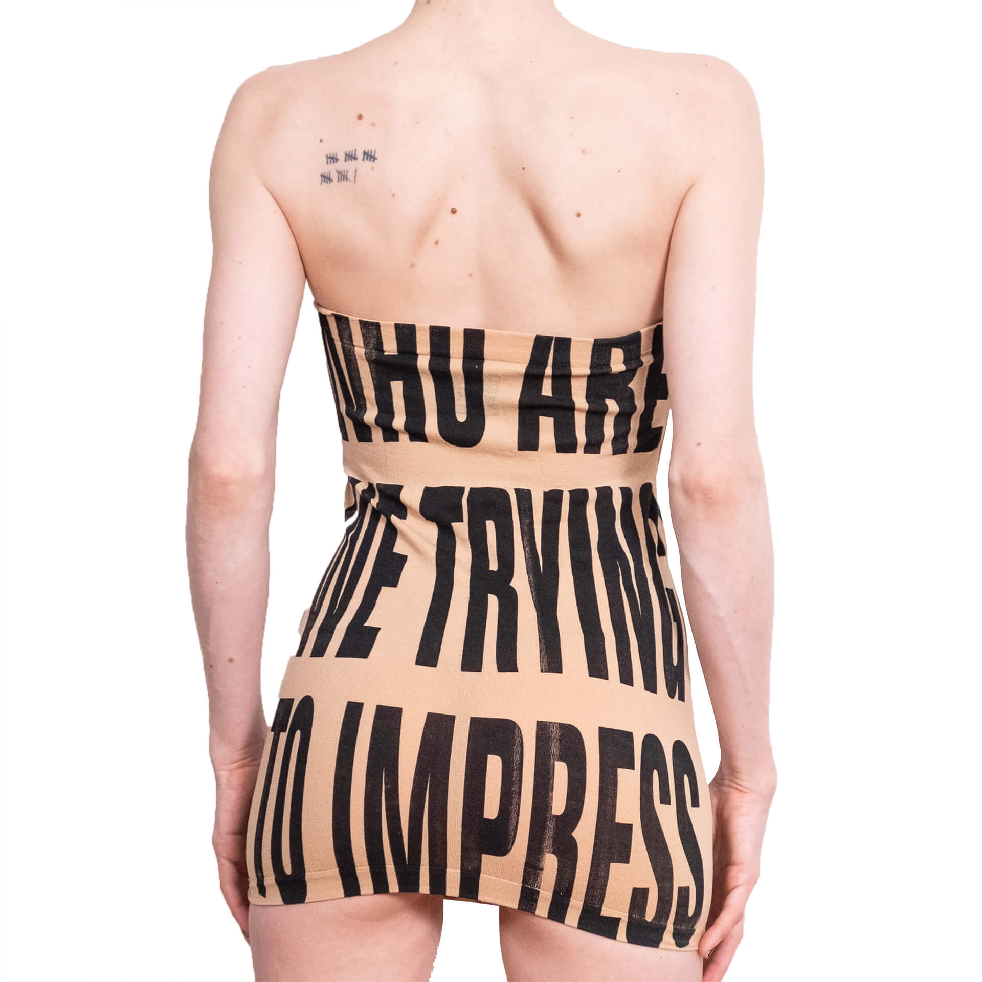 Beige strapless dress with black text on a white background